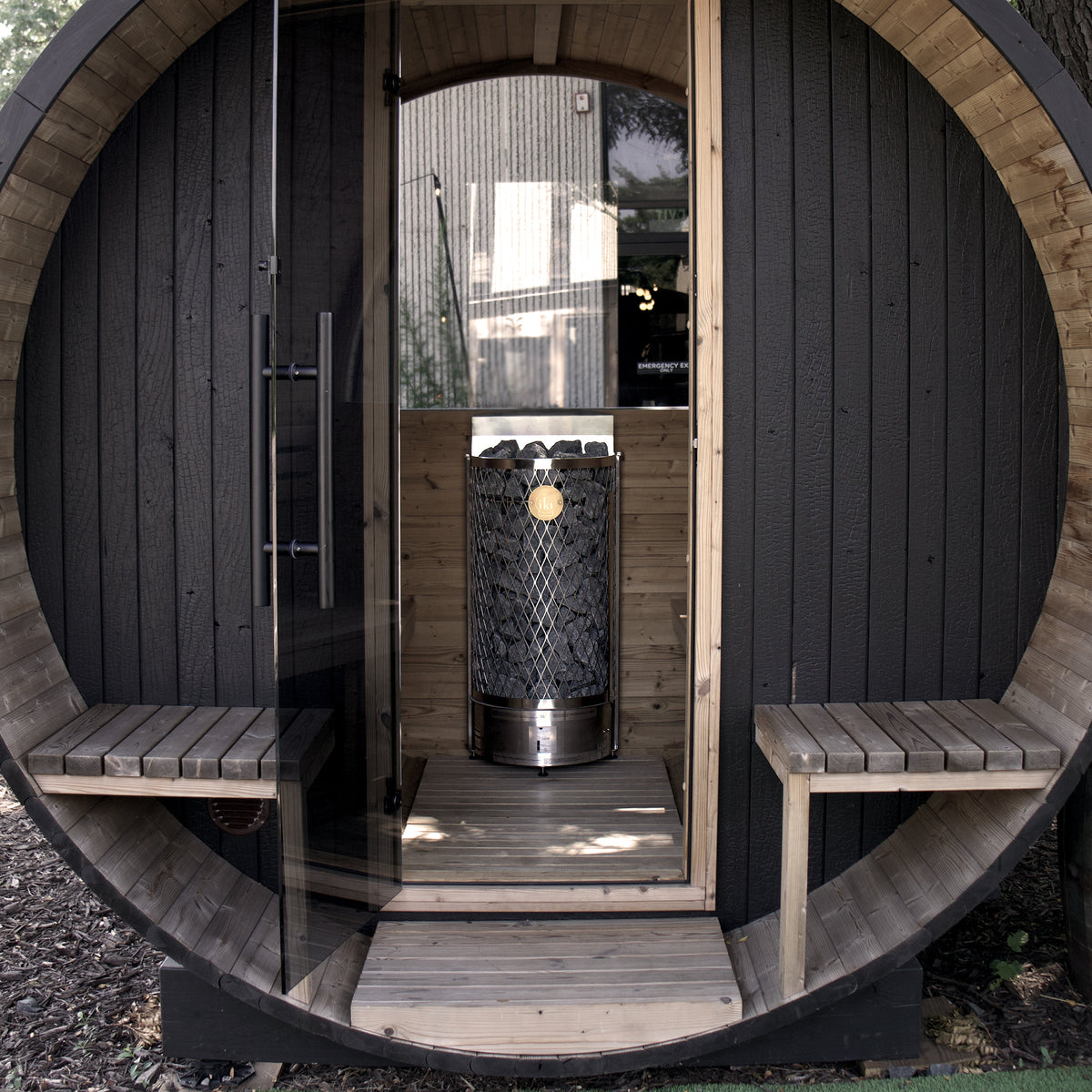 IKI Wall Short 9 kW electric sauna heater in a barrell sauna