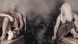 Man and woman in sauna enjoying löyly